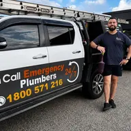 Plumber beside a service vehicle, Highett